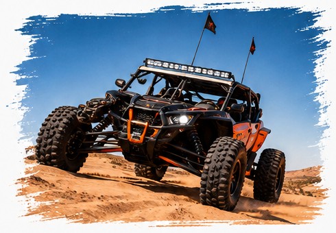 Off-road dune buggy driving across desert sand